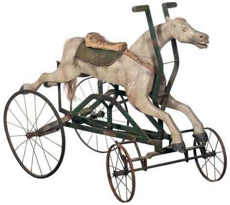 wooden horse mounted on a metal rolling chassis|Antique Horse On Wheels .